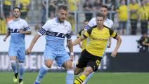 orial	ESSEN, GERMANY - AUGUST 12: Ciro Immobile of SS Lazio compete for the ball with Manuel Akanji of Borussia Dortmund during the Borussia Dortmund v Lazio - Pre-Season Friendly at the Essen Stadium on August 12, 2018 in Essen, Germany. (Photo by Marco Rosi/Getty Image
