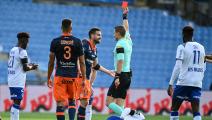 French refere Willy Delajod gives a red card to Montpellier's French defender Damien Le Tallec during the French L1 football match between Montpellier and Reims at the Mosson stadium in Montpellier, southern France, on October 25, 2020. (Photo by Pascal GUYOT / AFP) (Photo by PASCAL GUYOT/AFP via Getty Images)