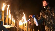 إضاءة شموع في ذكرى كارثة تشيرنوبيل (جينيا سافيلوف/ فرانس برس)