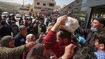 تزاحم على شراء الماء والخبز في العاصمة عمان 