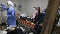 مصابون بكورونا في مستشفى المواساة الجامعي في دمشق (لؤي بشارة/ فرانس برس)