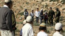 مواجهات بين فلسطينيين ومستوطنين وجنود الاحتلال (حازم بدر/فرانس برس)