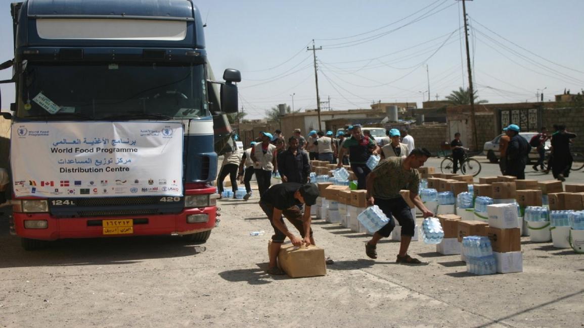 العراق- مجتمع- مساعدات غذائية لبلدة القيارة-6-9-2016