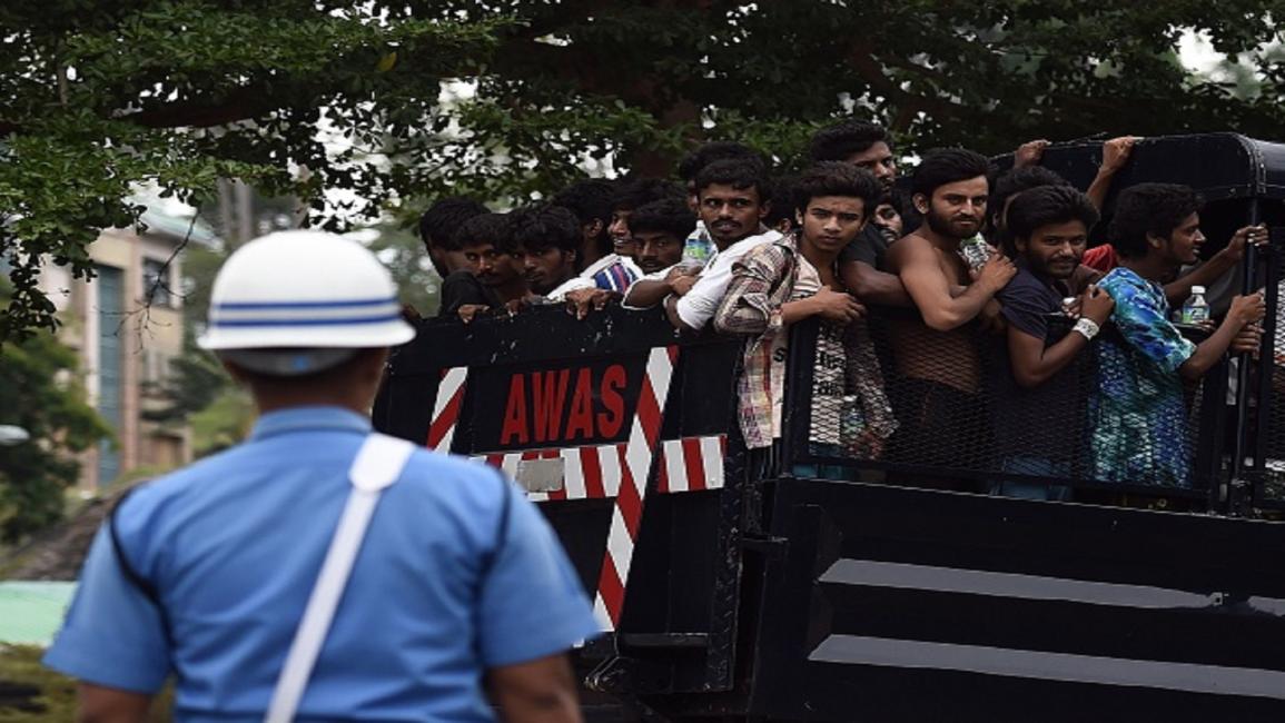 لاجئون من أقلية الروهينجا بعد وصولهم إلى ماليزيا