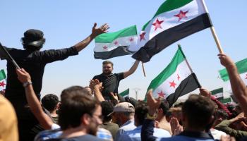 مظاهرة في إدلب ردا على تصريحات أوغلو (فرانس برس)
