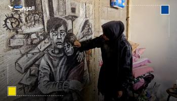 فلسطينية ترسم معاناة أطفال غزة